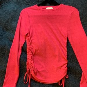 Neon pink fitted top with adjustable sides